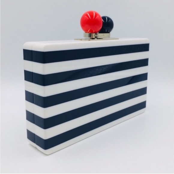kate spade Handbags - Kate Spade Striped Clutch with Red and Blue Accents
